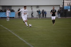 Soccer player mid-kick